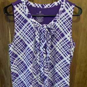 Sleeveless shirt purple & white on front, solid purple on back.